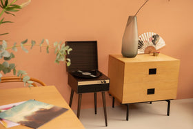 Crosley Jasper walnut finish with gold accents boosts home decor and style.