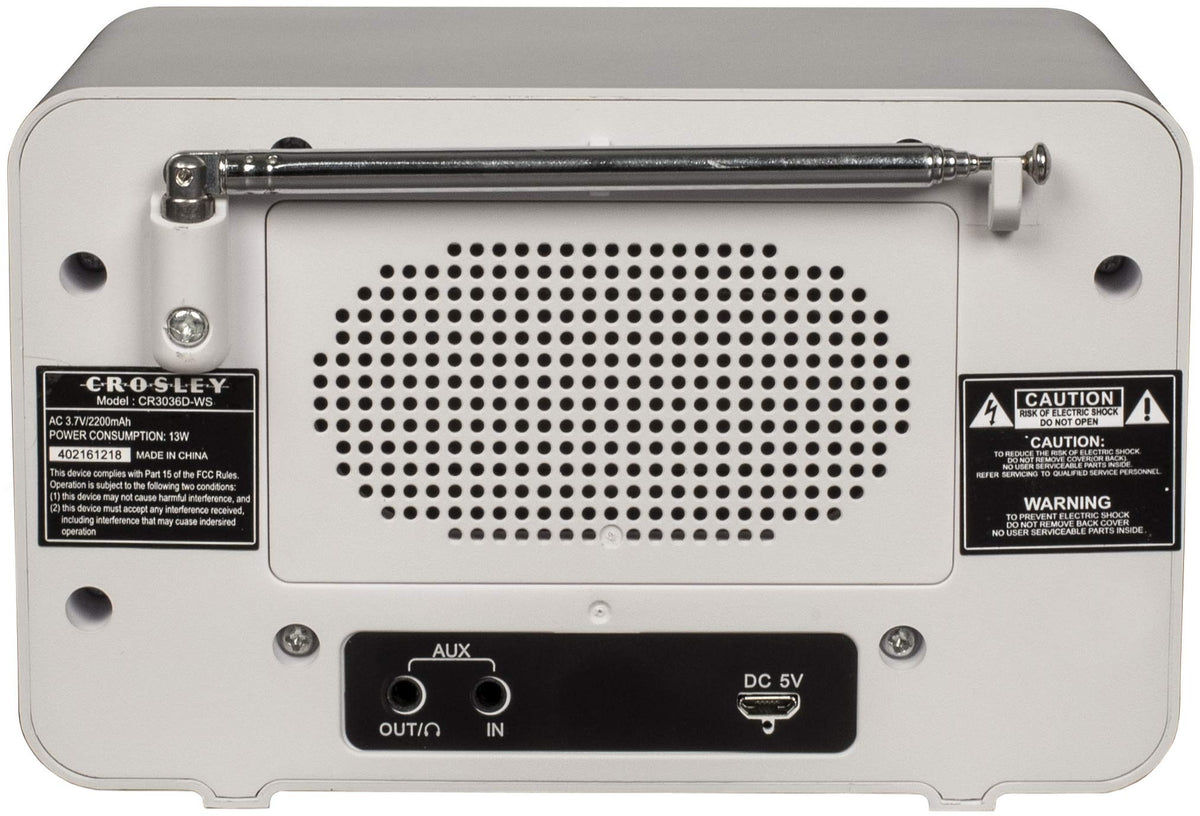 Crosley Tribute on a nightstand beside a book to show compact scale and bedside convenience