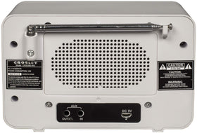 Crosley Tribute on a nightstand beside a book to show compact scale and bedside convenience