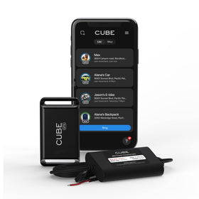 Cube GPS Tracker in a car front view for real-time vehicle tracking.