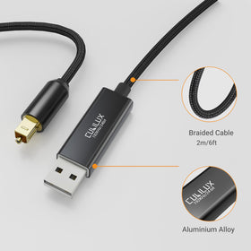 Cubilux USB-A to TOSLINK cable on a desk setup for PC/PS5