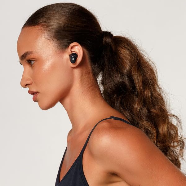 Cubitt Power Buds held in hand to show compact size and portability advantage
