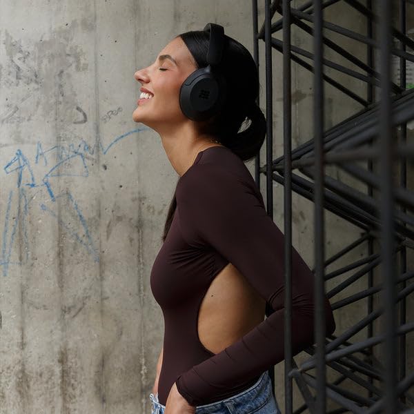 Cubitt Power Headphones worn by commuter demonstrating noise control benefit
