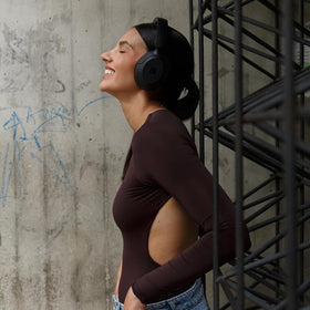 Cubitt Power Headphones worn by commuter demonstrating noise control benefit