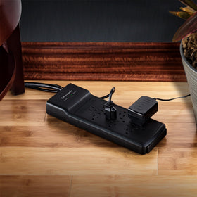 CyberPower shown next to a power brick and phone for scale and outlet compatibility