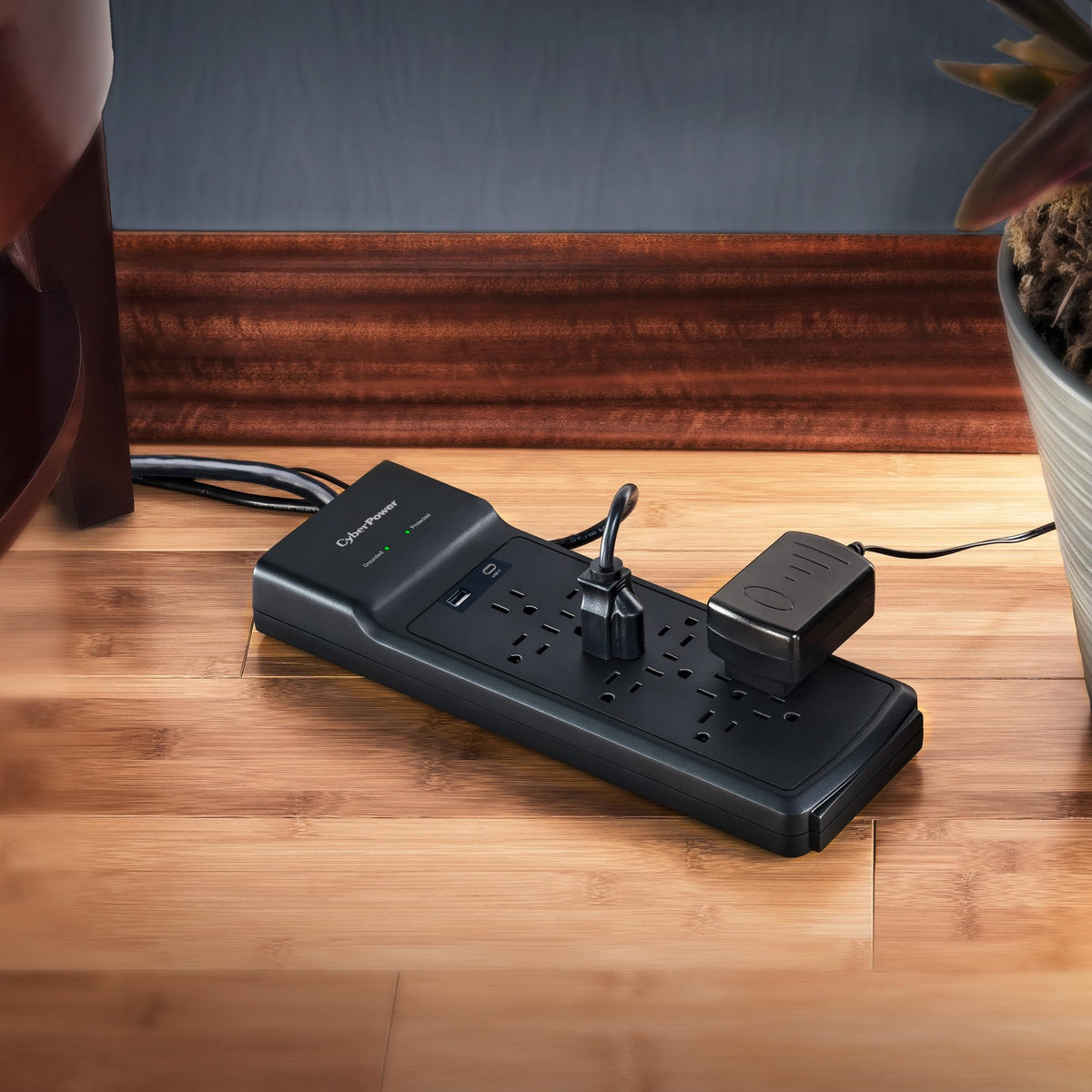 CyberPower next to smartphone showing scale and room for multiple large adapters