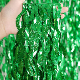 CYLMFC green tinsel curtain creates a festive wall backdrop.