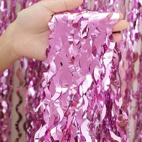 CYLMFC pink fringe curtain showcases wavy shape and reflective shine for festive atmospheres.