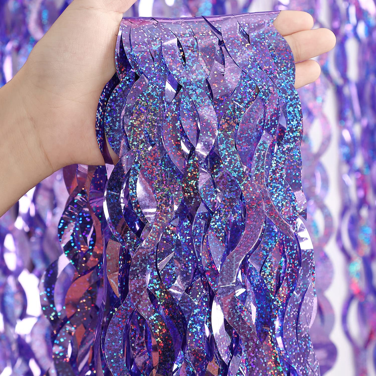 CYLMFC purple foil fringe curtain backdrop setup adds instant sparkle to party photos.