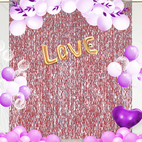 CYLMFC rose gold tinsel curtain layered for a thicker backdrop.