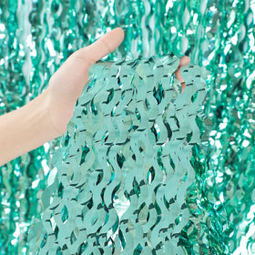 CYLMFC teal wave foil curtain highlights stage decor and entryways with sparkle