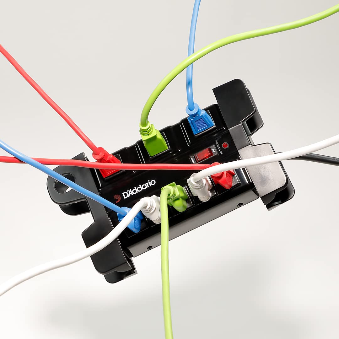 D'Addario Power Base under a pedalboard in use, keeps cables organized and gear powered