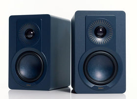 DALI KUPID pair with wall-mount setup showing flexible placement for ideal listening.
