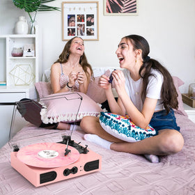 DANFI AUDIO DF pink belt-drive turntable reduces vibration for smooth playback.