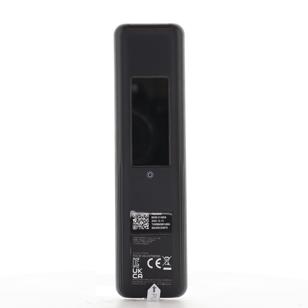 Dan's Originals remote in hand pointing at TV, precise pointer navigation benefit