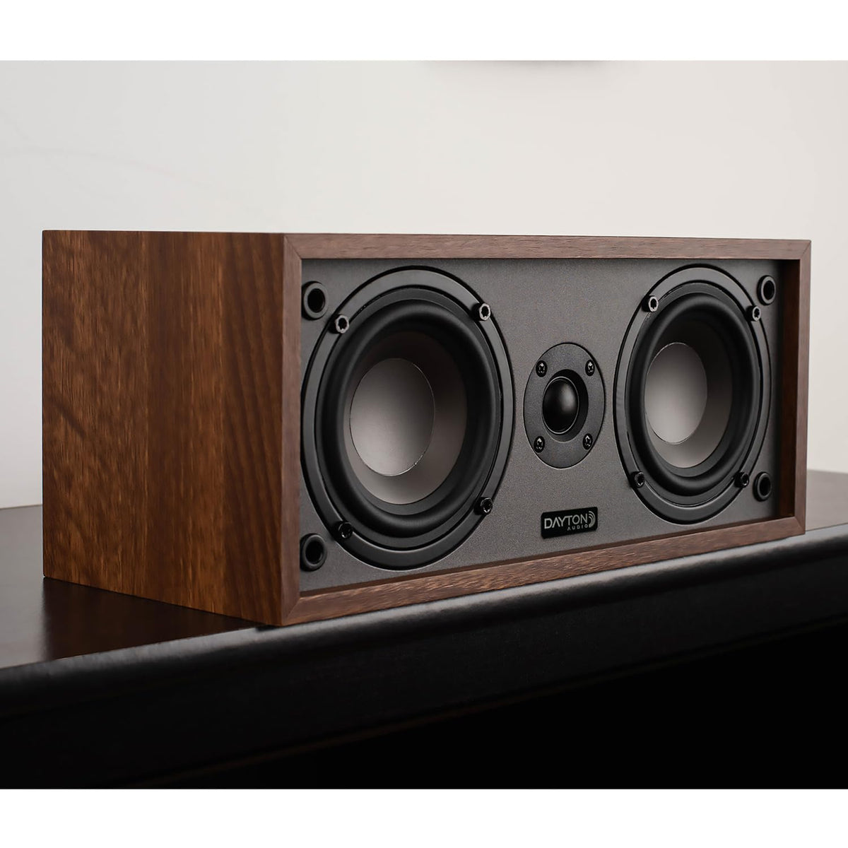 Dayton Audio C40 wall-mounted in wood-grain finish saving shelf space with even coverage