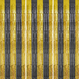 DECOCKRAT foil fringe curtains in black and gold create a glamorous backdrop for celebrations.