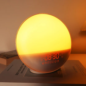 Dekala sunrise alarm clock front view with clear display and gentle wake glow.