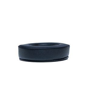 Dekoni Audio pad next to coin showing size and correct fit advantage