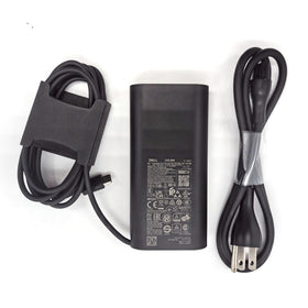 Dell 100W USB-C GAN charger compact unit on desk setup.