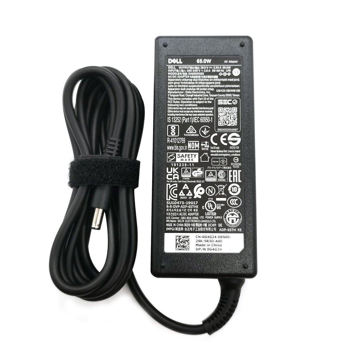 Dell 65W charger side view highlights slim profile for desk or bag.