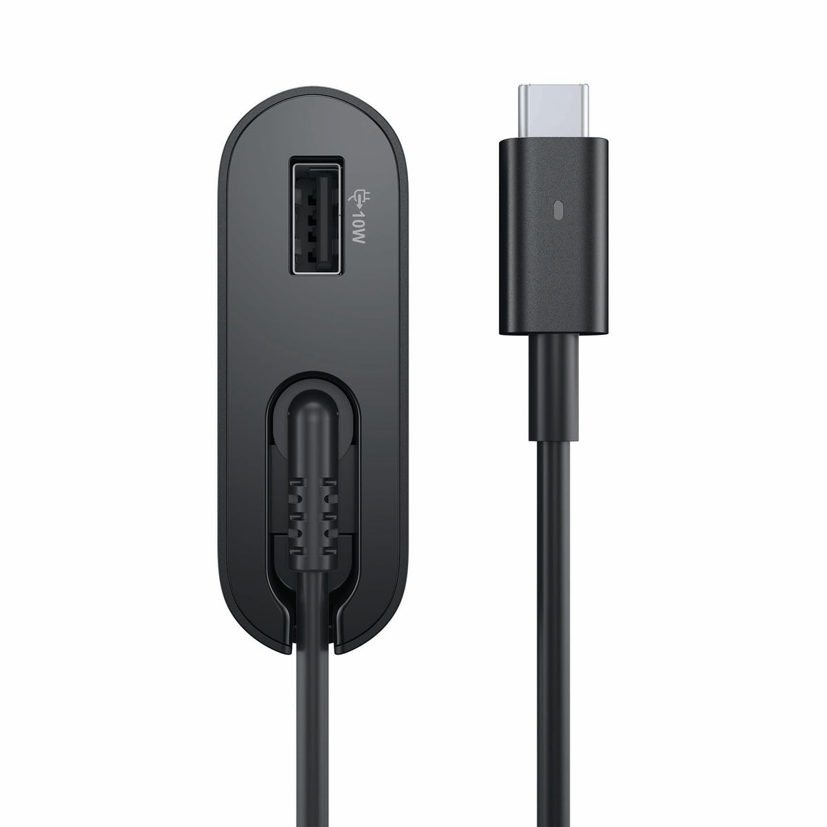 Dell adapter beside laptop for scale showing compact travel-friendly size