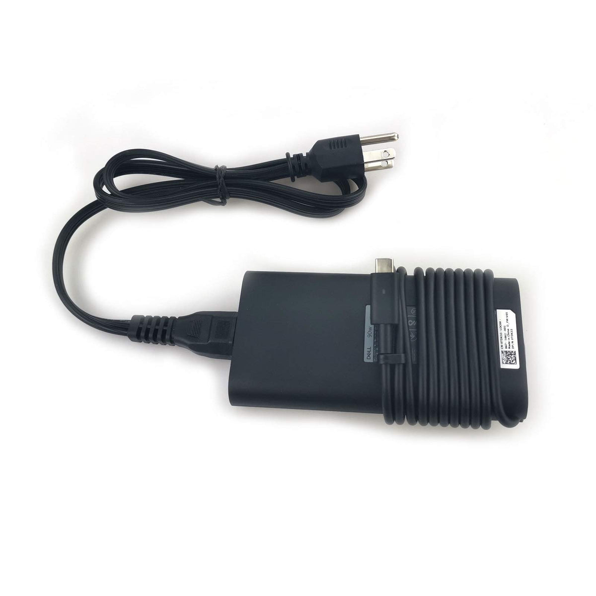 Dell charger plugged into laptop on desk demonstrating fast charging convenience