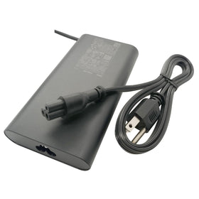 Dell adapter powering a laptop on desk for uninterrupted performance