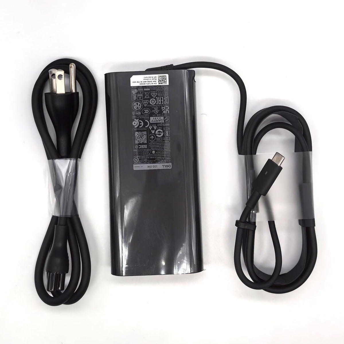 Dell adapter plugged into XPS15 demonstrating full-power charging