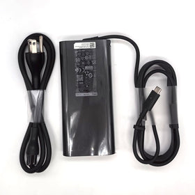 Dell adapter plugged into XPS15 demonstrating full-power charging