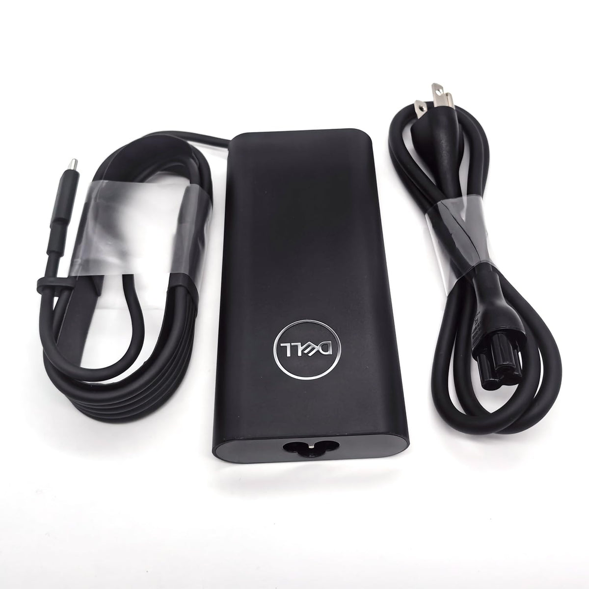 Dell adapter label showing DA130PM170 specs and safe output ratings