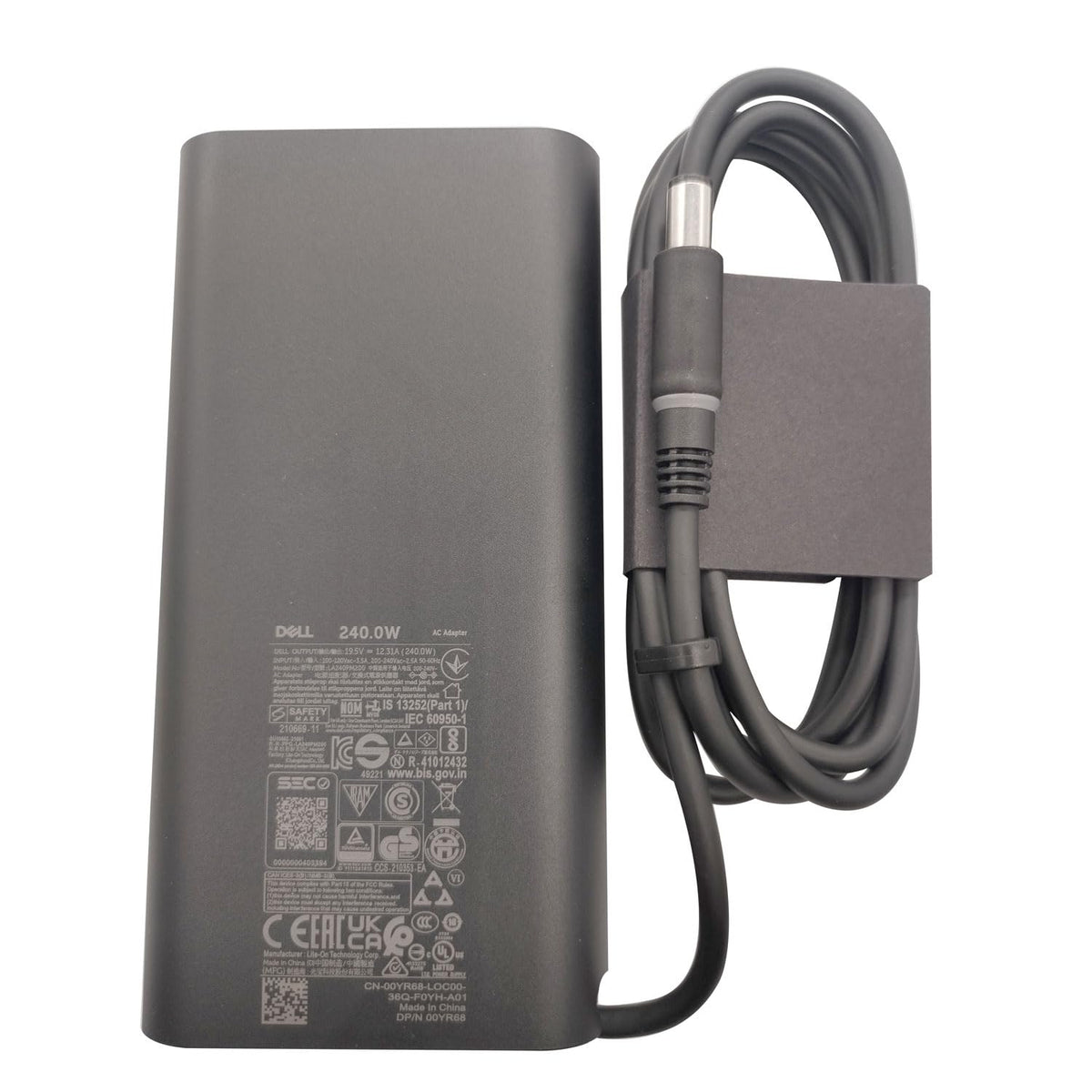 Dell adapter next to ruler showing compact size and portability