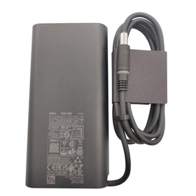 Dell adapter next to ruler showing compact size and portability