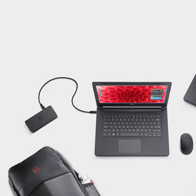 Dell D3100 desk-setup shot depicts a tidy, multi-monitor workspace