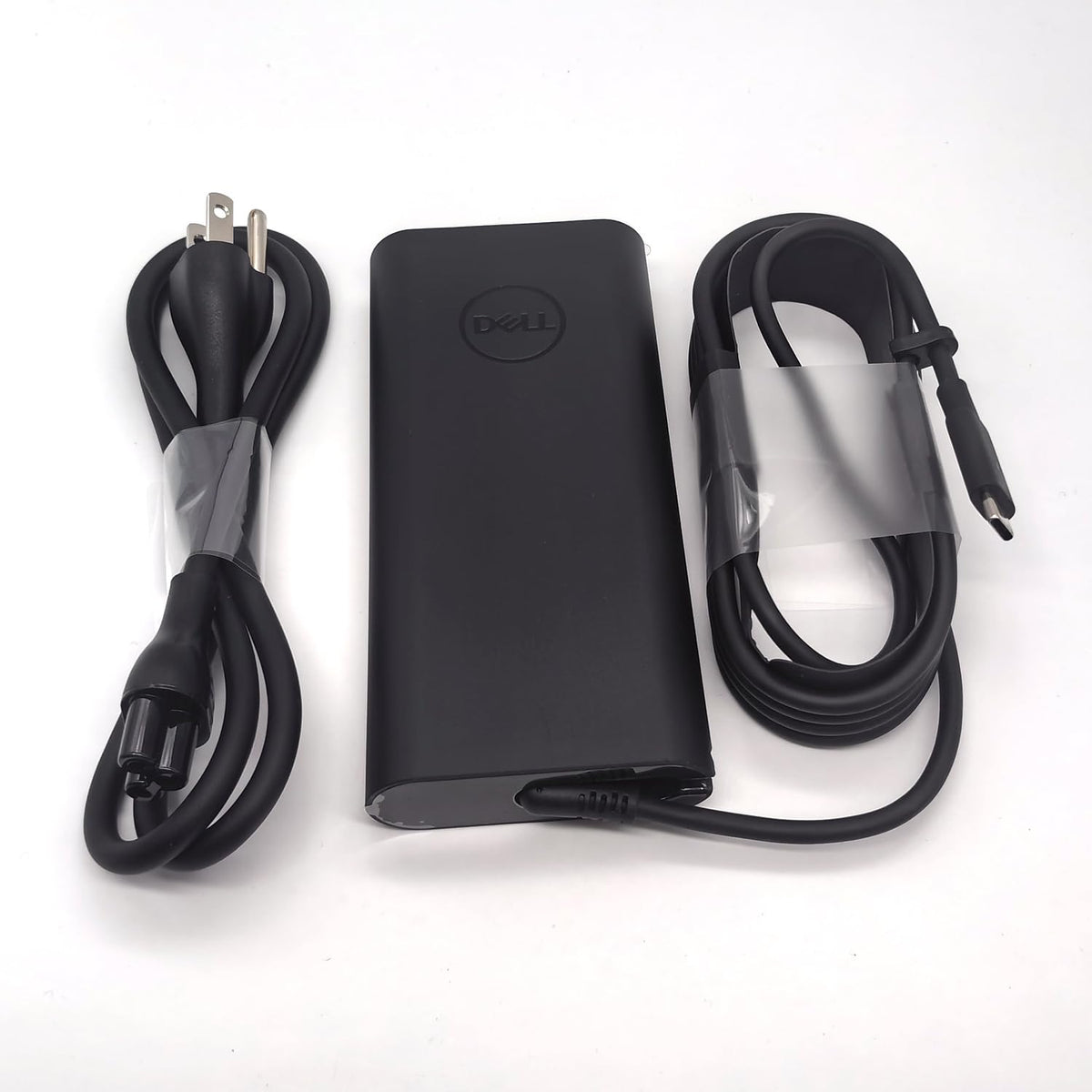 Dell adapter plugged into Precision laptop enabling reliable charging