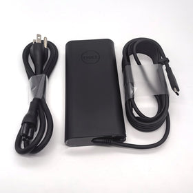 Dell adapter plugged into Precision laptop enabling reliable charging