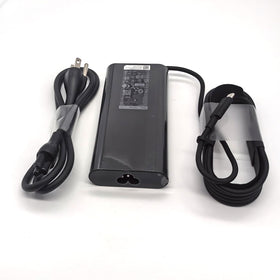 Dell adapter scale comparison in hand illustrating compact portability