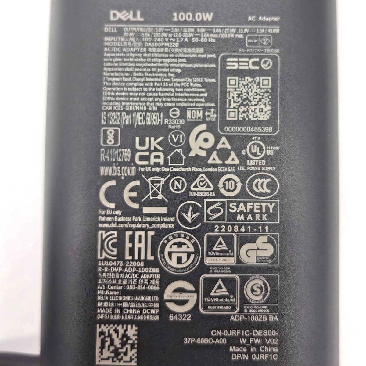 Dell GAN charger non retail packaging with authenticity notes.