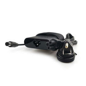 Dell charger close-up showing the proprietary connector and plug