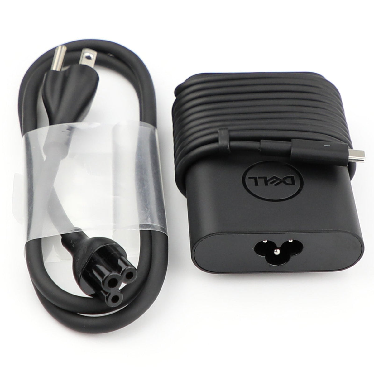 Dell New Genuine 65W USB-C adapter in use, charging a laptop at a desk