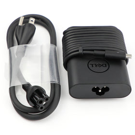 Dell New Genuine 65W USB-C adapter in use, charging a laptop at a desk