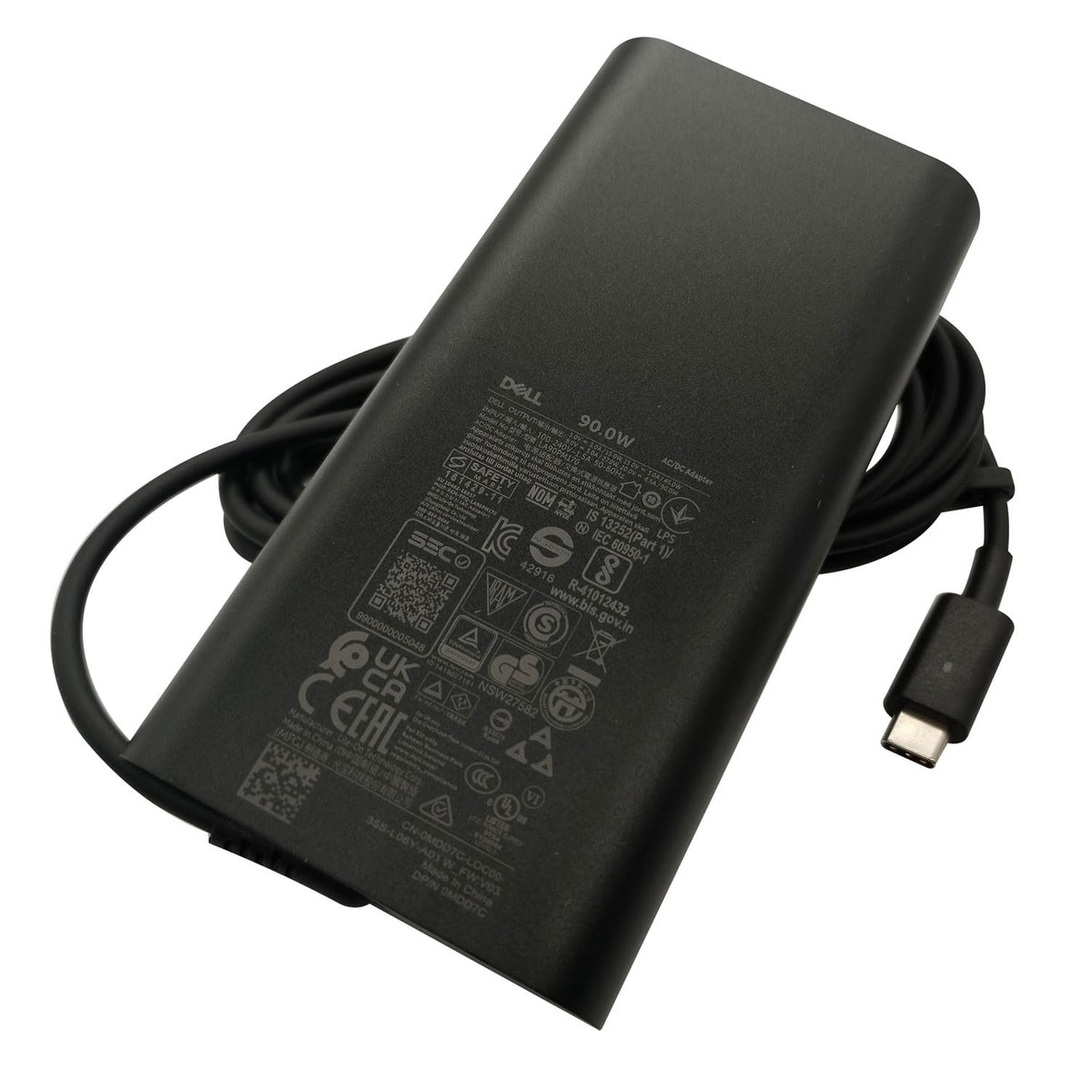 Dell adapter next to a ruler to show compact size and travel friendliness