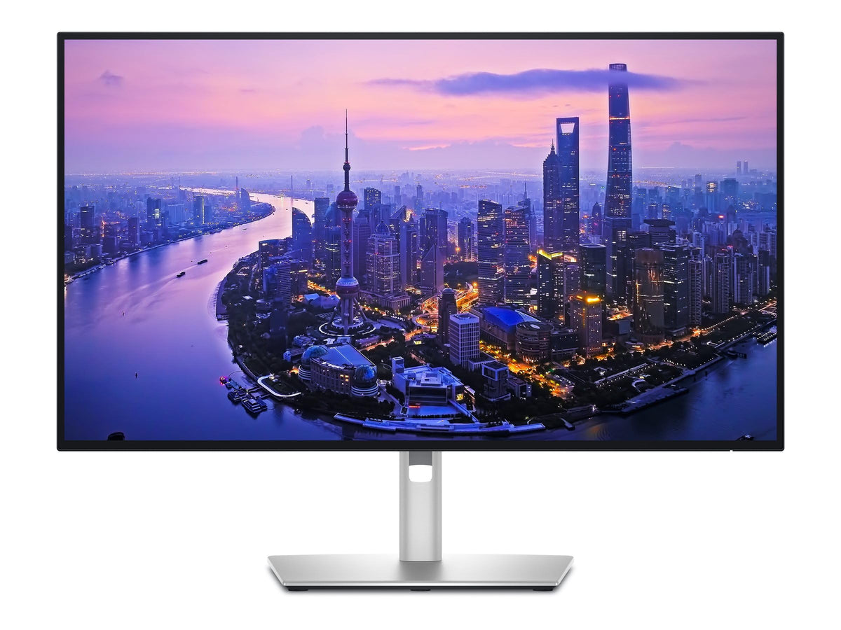 Dell UltraSharp 27 on a busy desk illustrating multitasking workspace.
