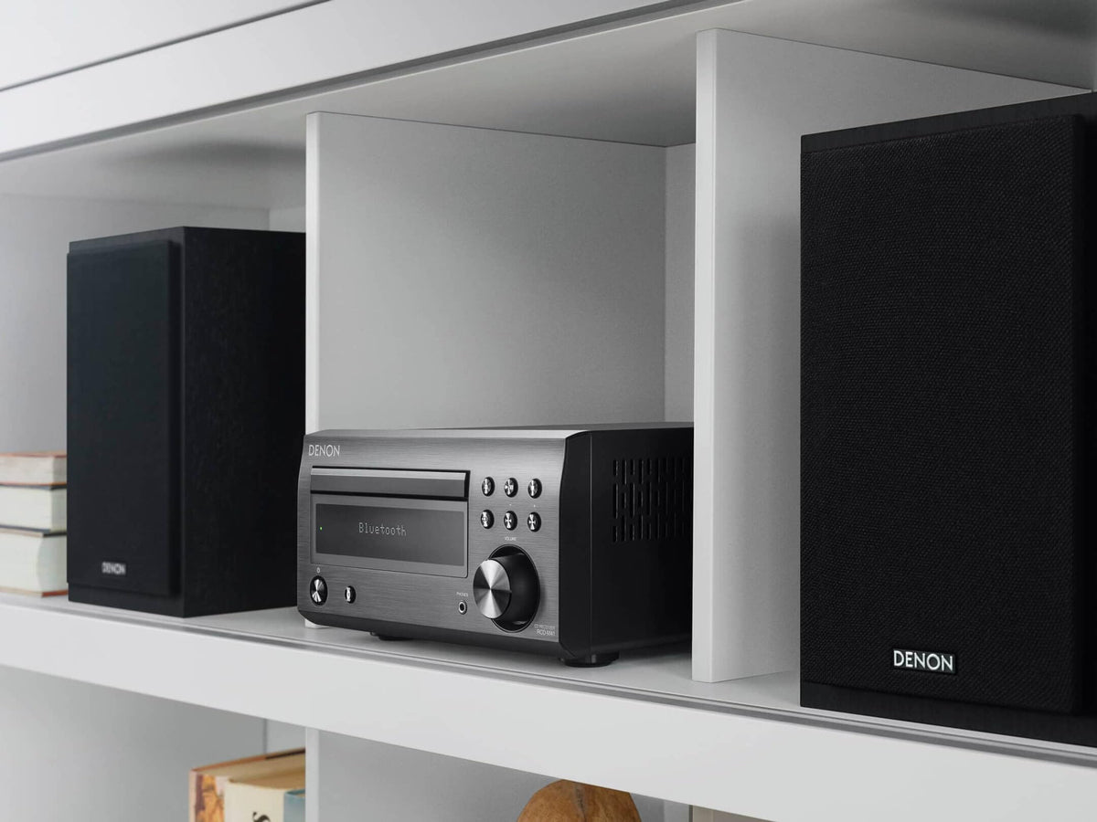 Denon D-M41 speakers closeup highlighting woofer and tweeter for smooth, natural sound.