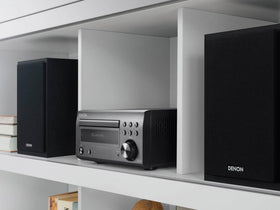 Denon D-M41 speakers closeup highlighting woofer and tweeter for smooth, natural sound.