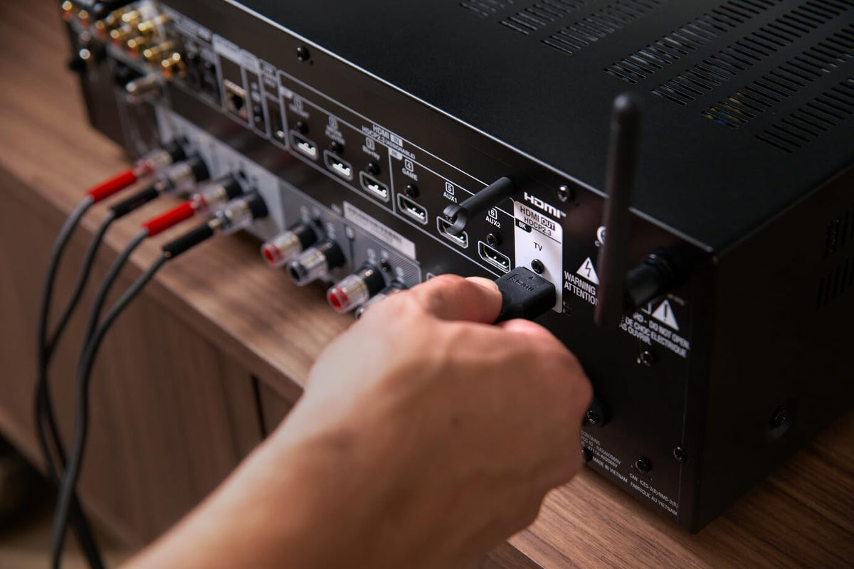 Denon DRA-900H subwoofer and zone preouts enable flexible layouts.