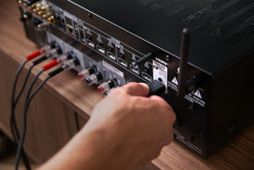 Denon DRA-900H subwoofer and zone preouts enable flexible layouts.