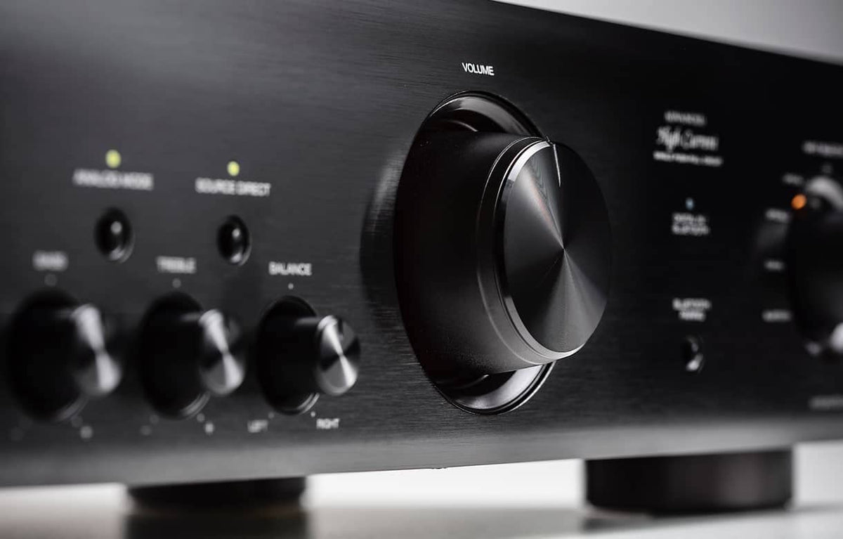 Denon PMA-600NE with speakers setup demonstrates powerful stereo performance in a living room.