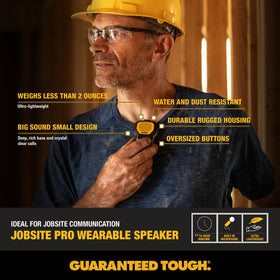 DEWALT speaker with added footer stands upright on a bench