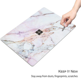 Digi-Tatoo cracked marble skin on Laptop Go 2 adds elegant, fingerprint-resistant style.